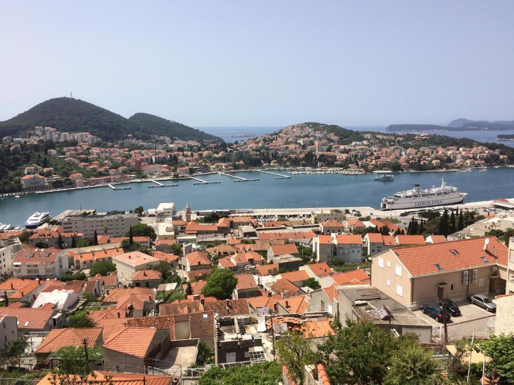 a view of a city with boats in the water at Apartment Elezovic in Dubrovnik
