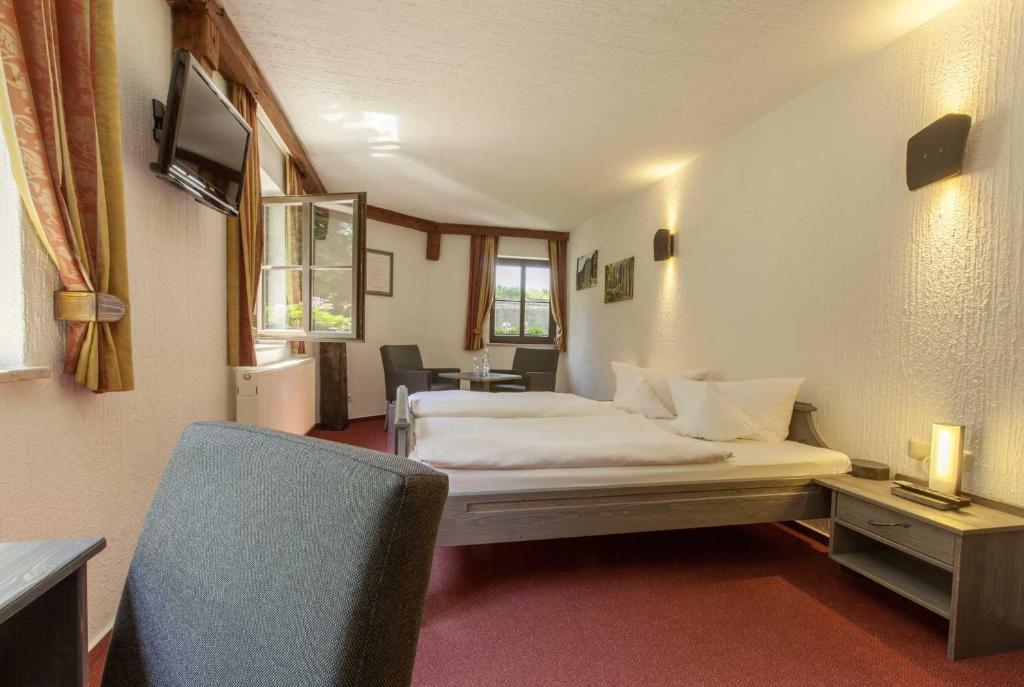 Postel nebo postele na pokoji v ubytování Burghotel Stolpen
