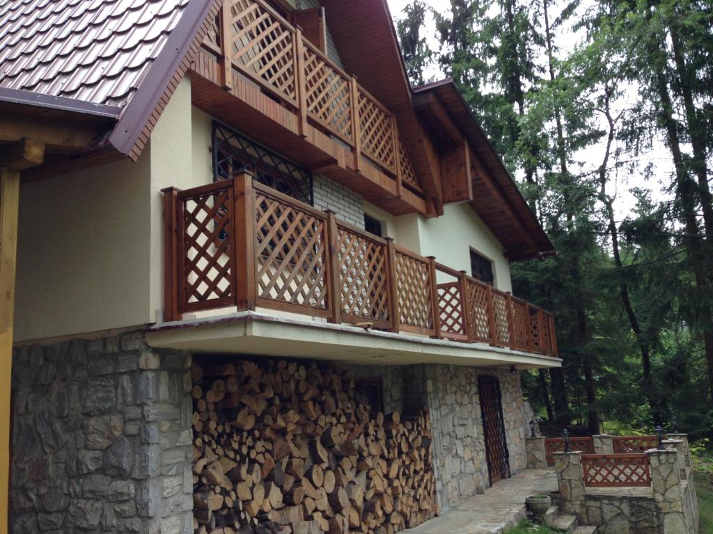 a house with wooden balconies on the side of it at Residenz Pal in Kokava na Rimavica