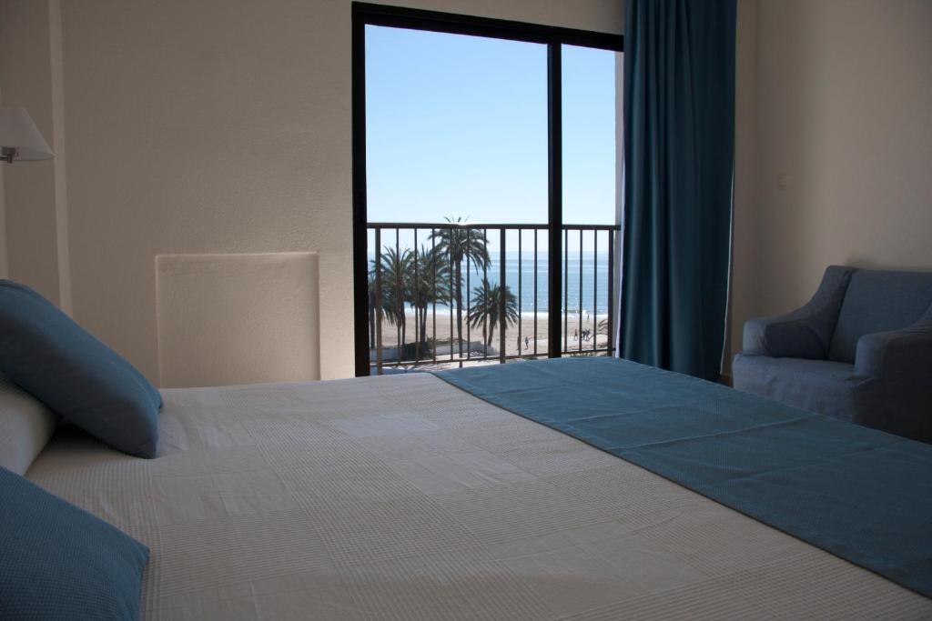 Postel nebo postele na pokoji v ubytování Hotel Sicania