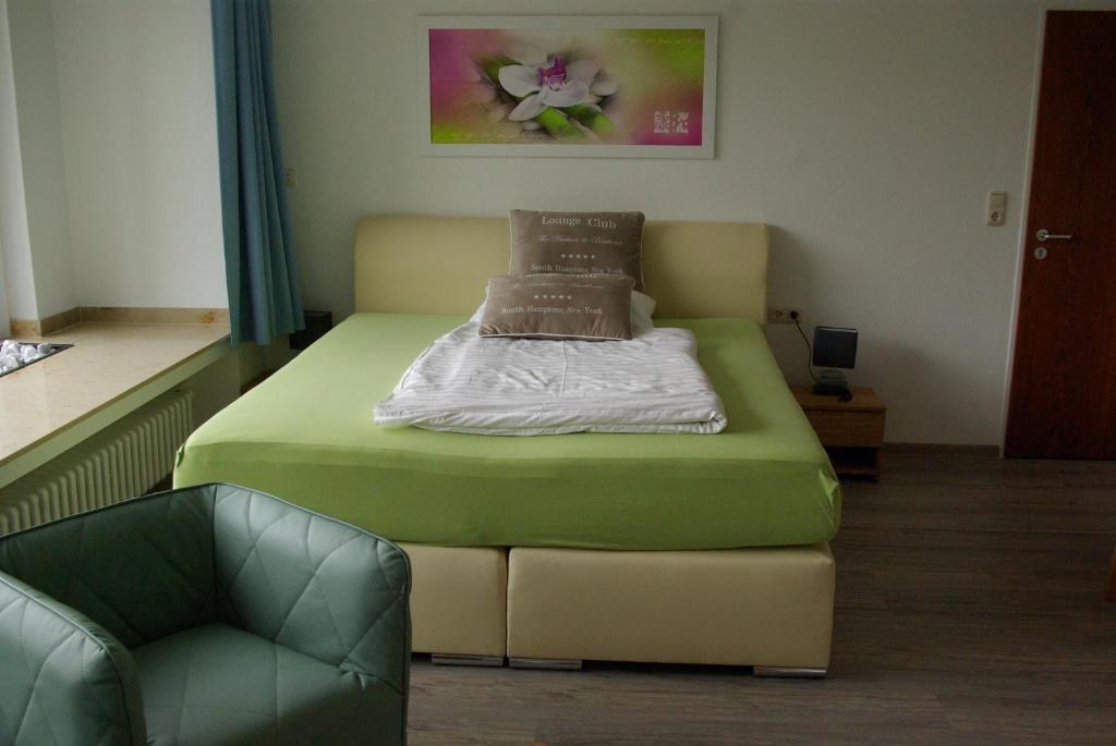 Postel nebo postele na pokoji v ubytování Gästehaus Schewe