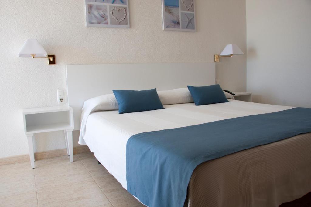 Postel nebo postele na pokoji v ubytování Hotel Sicania