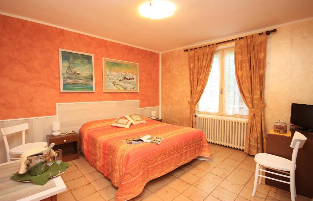 Postel nebo postele na pokoji v ubytování Hotel Colomber