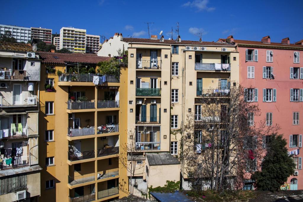 an apartment building in the city of paris at Hotel le Dauphin in Ajaccio
