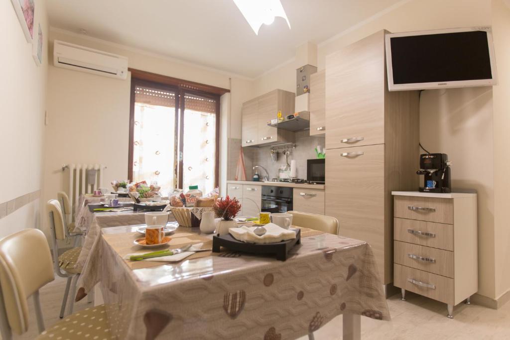 Kuchyň nebo kuchyňský kout v ubytování SuiteIRIS B&B