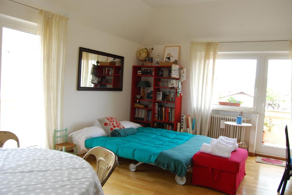 Łóżko lub łóżka w pokoju w obiekcie A Casa di Lola