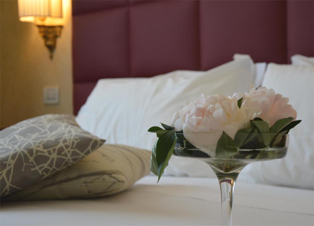 Postel nebo postele na pokoji v ubytování Astoria Hotel Italia