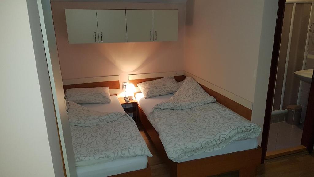 Postel nebo postele na pokoji v ubytování Guest house Kruna