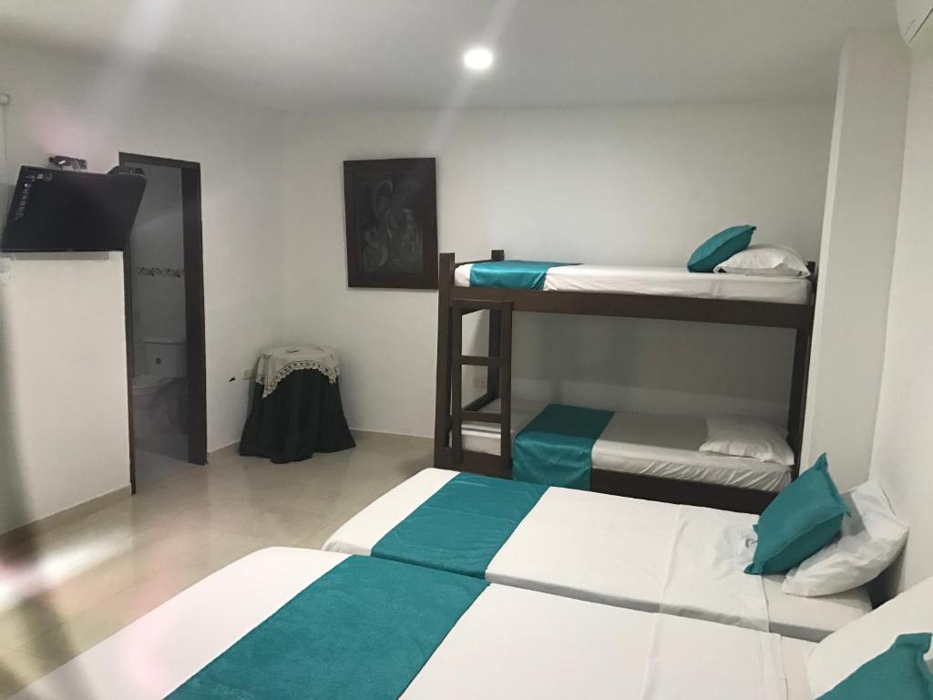 Voodi või voodid majutusasutuse Mayva AprtaHotel toas
