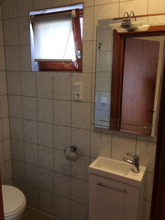 Koupelna v ubytování Guesthouse