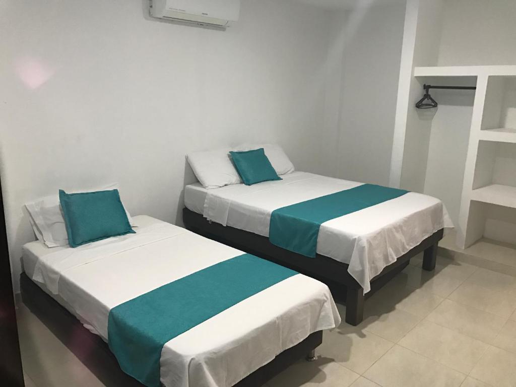 Voodi või voodid majutusasutuse Mayva AprtaHotel toas