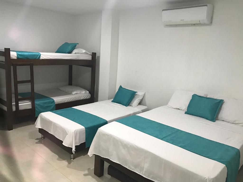 Voodi või voodid majutusasutuse Mayva AprtaHotel toas