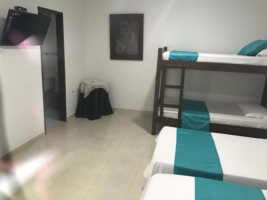 Voodi või voodid majutusasutuse Mayva AprtaHotel toas