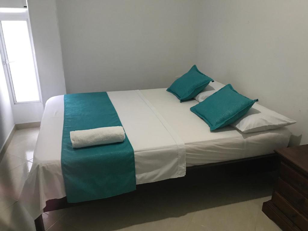 Voodi või voodid majutusasutuse Mayva AprtaHotel toas