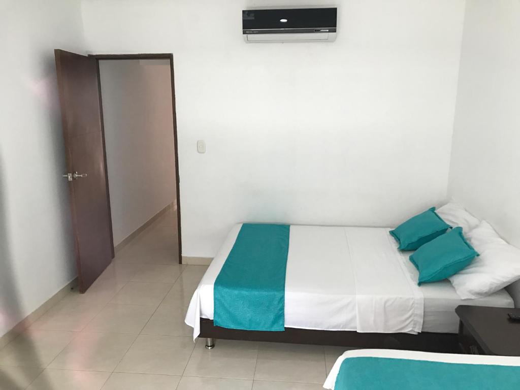 Voodi või voodid majutusasutuse Mayva AprtaHotel toas