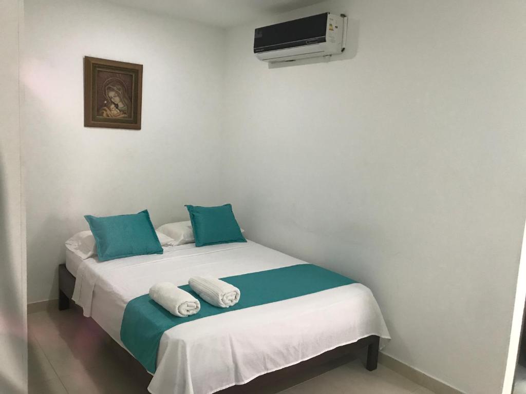 Voodi või voodid majutusasutuse Mayva AprtaHotel toas
