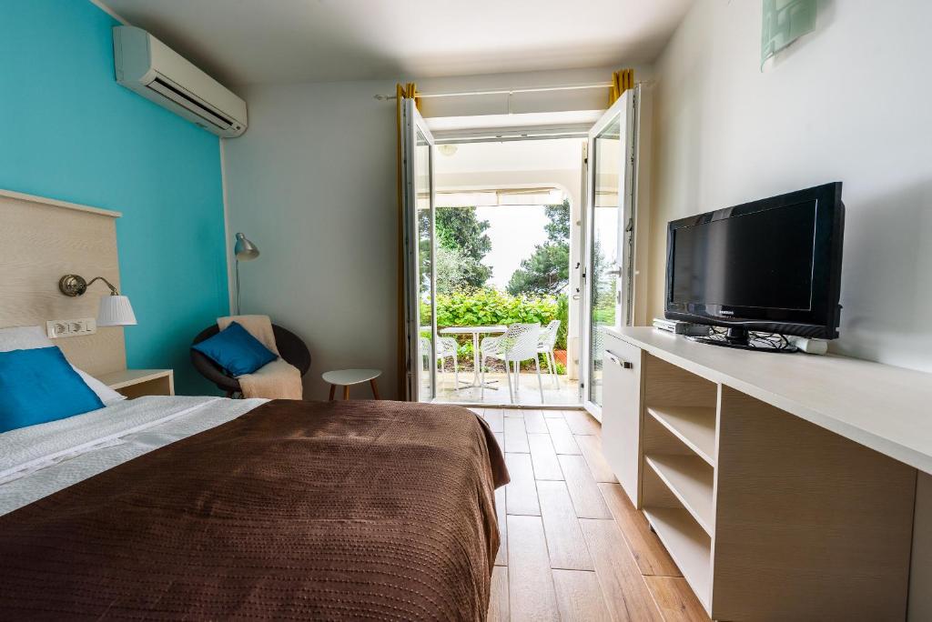 TV a/nebo společenská místnost v ubytování Apartments & Rooms Matos