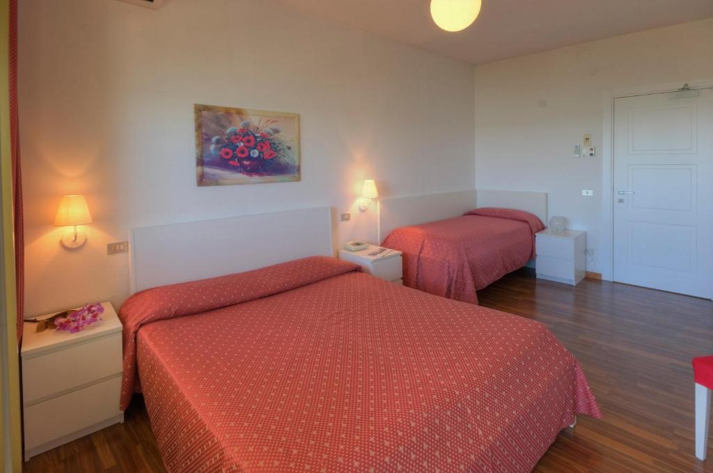 Postel nebo postele na pokoji v ubytování Hotel Eden Gigli