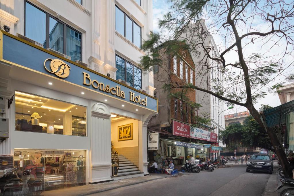 a storefront of a store on a city street at Bonsella Hotel in Hanoi