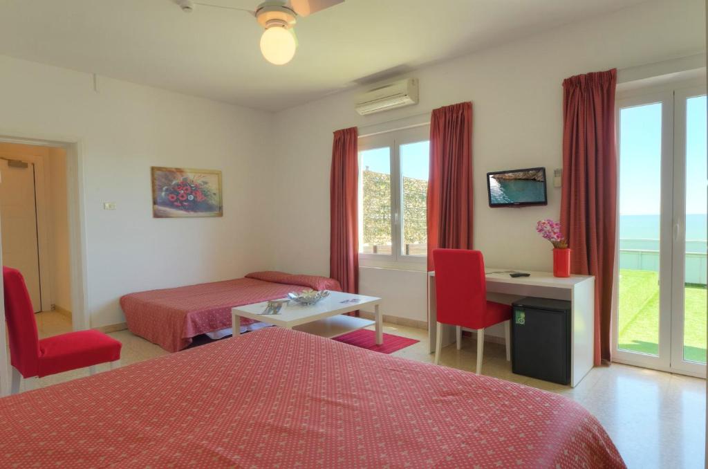 Postel nebo postele na pokoji v ubytování Hotel Eden Gigli