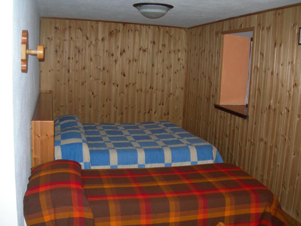 Postel nebo postele na pokoji v ubytování Agriturismo Lo Ratelé