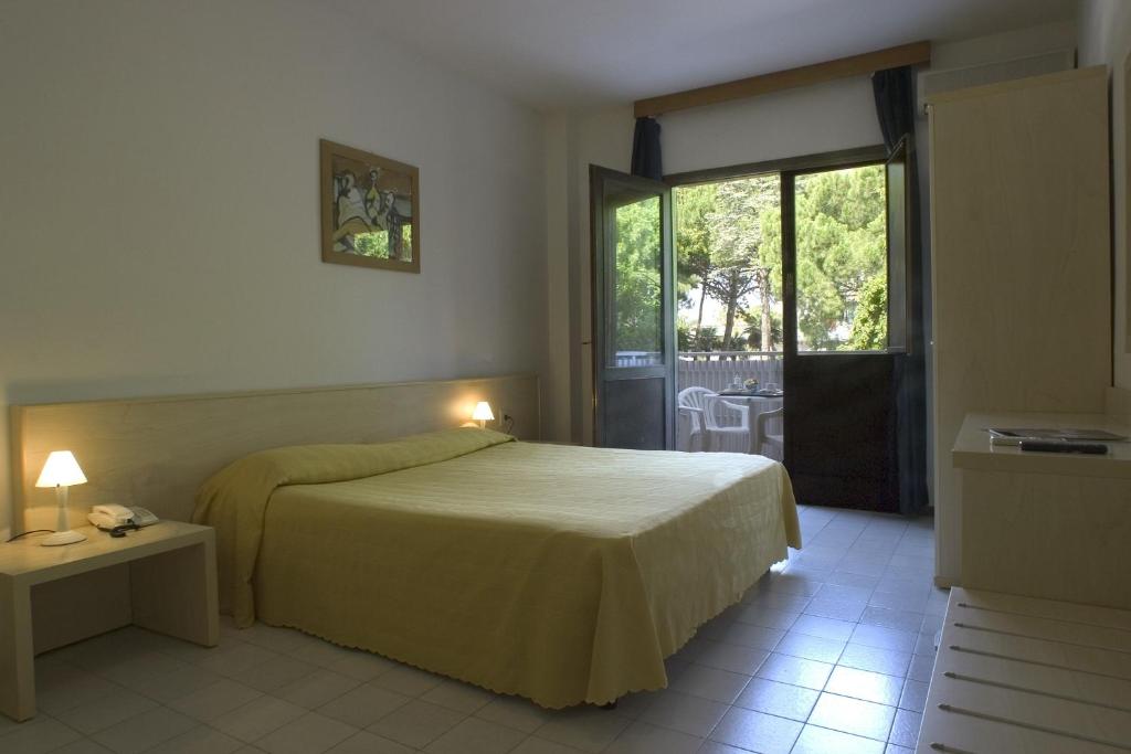 Postel nebo postele na pokoji v ubytování Hotel Santa Cruz