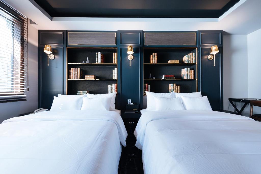 Postel nebo postele na pokoji v ubytování Boutique Hotel XYM Pyeongtaek