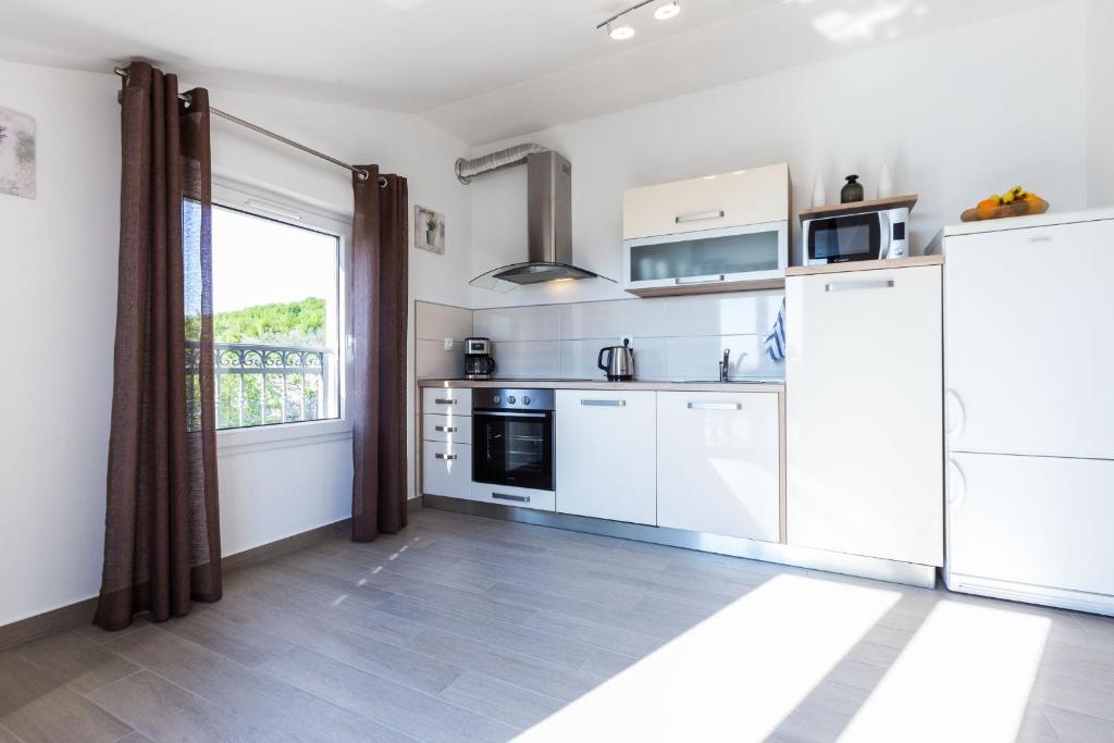 Kuchyň nebo kuchyňský kout v ubytování Apartment Marko