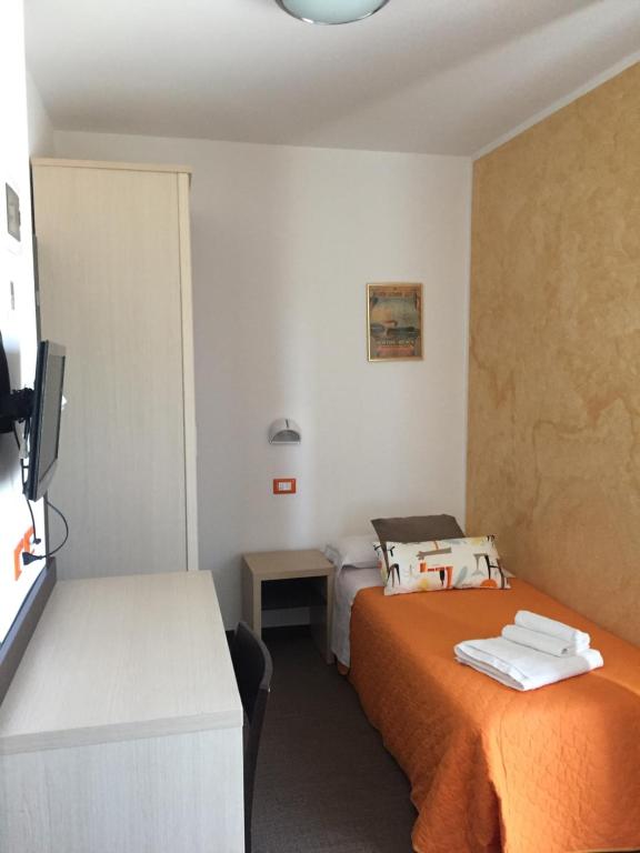 Łóżko lub łóżka w pokoju w obiekcie Hotel Belvedere Spiaggia