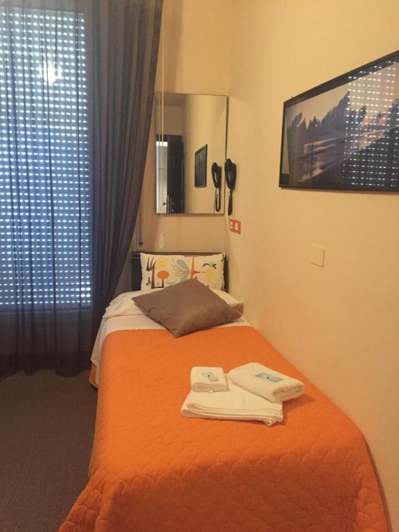 Łóżko lub łóżka w pokoju w obiekcie Hotel Belvedere Spiaggia