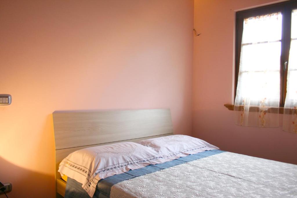 Postel nebo postele na pokoji v ubytování Casa Rolu