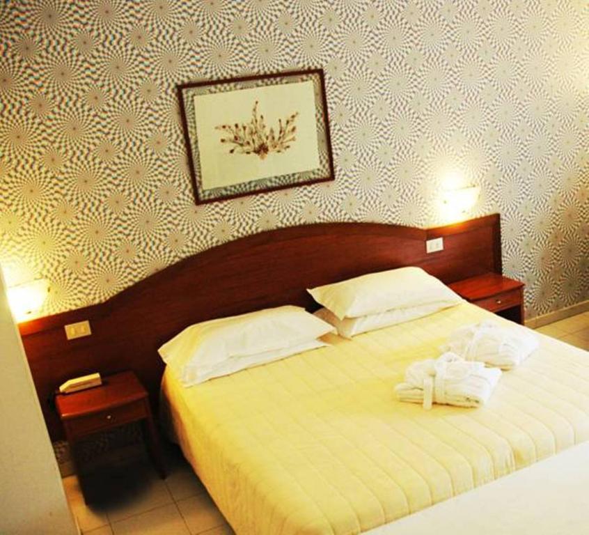 Postel nebo postele na pokoji v ubytování Villa Dei Principi Hotel