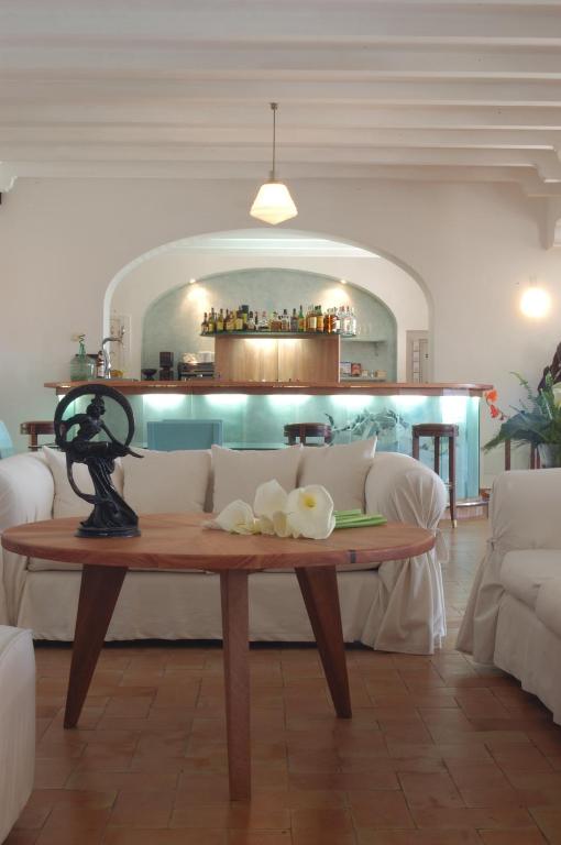 a living room with a couch and a table at Hotel Punta Sur in Tarifa