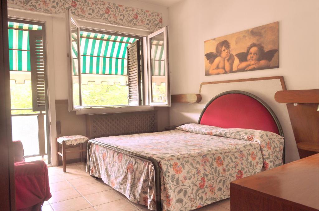 Postel nebo postele na pokoji v ubytování Hotel Roma
