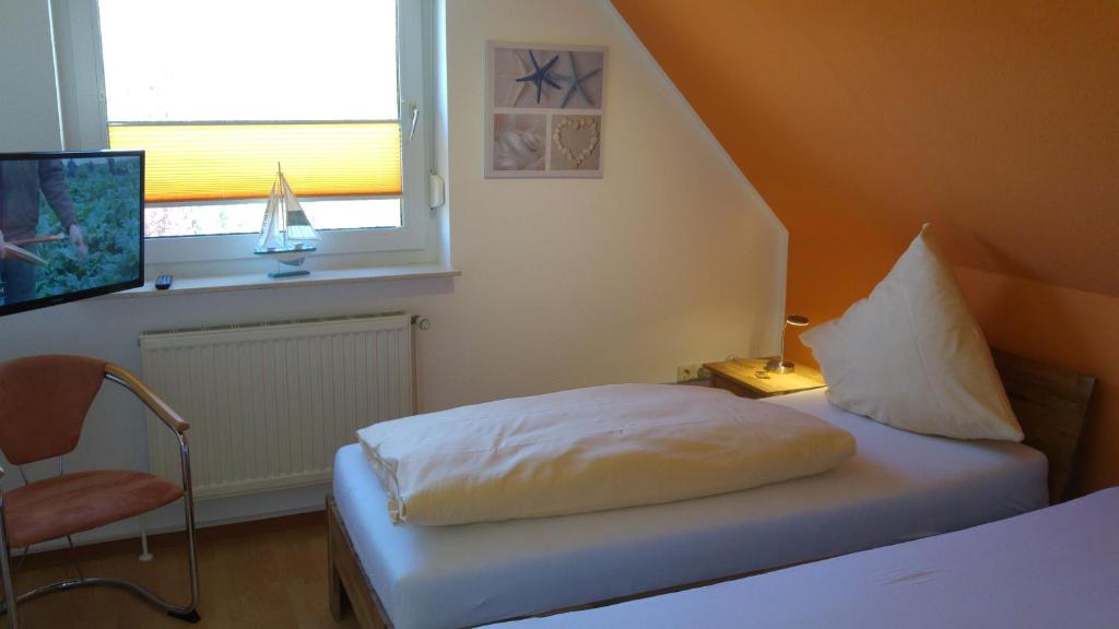 Postel nebo postele na pokoji v ubytování Naturwert Hotel Garni Ursula