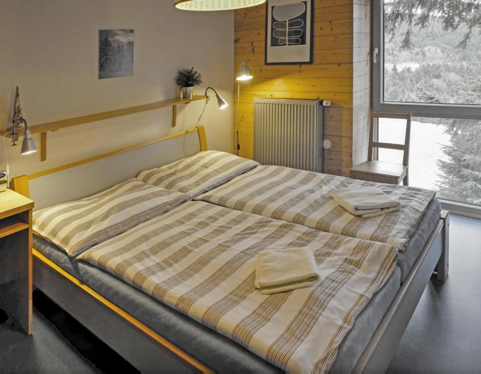Postel nebo postele na pokoji v ubytování Chata H&D Červenohorské Sedlo