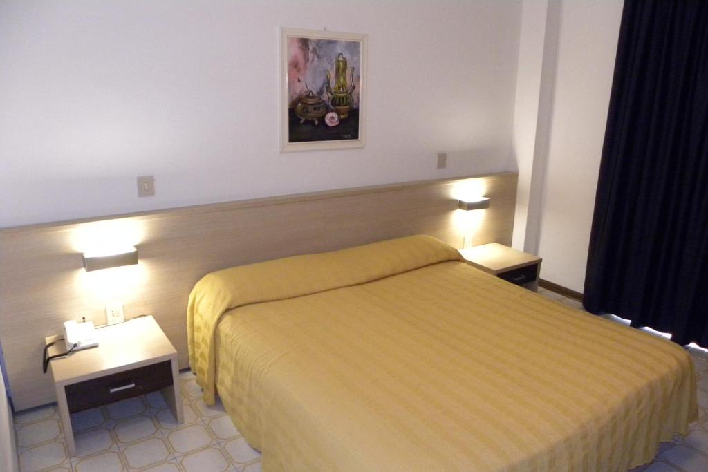 Postel nebo postele na pokoji v ubytování Hotel Santa Cruz
