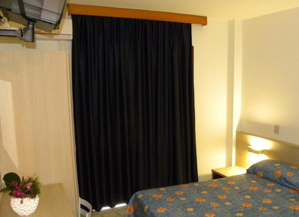 Postel nebo postele na pokoji v ubytování Hotel Santa Cruz