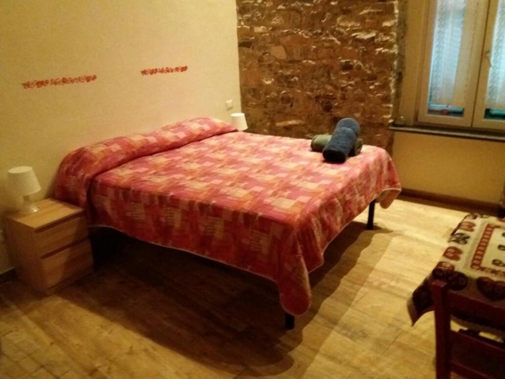 Postel nebo postele na pokoji v ubytování Apartment Camere Cinque Terre Andrea