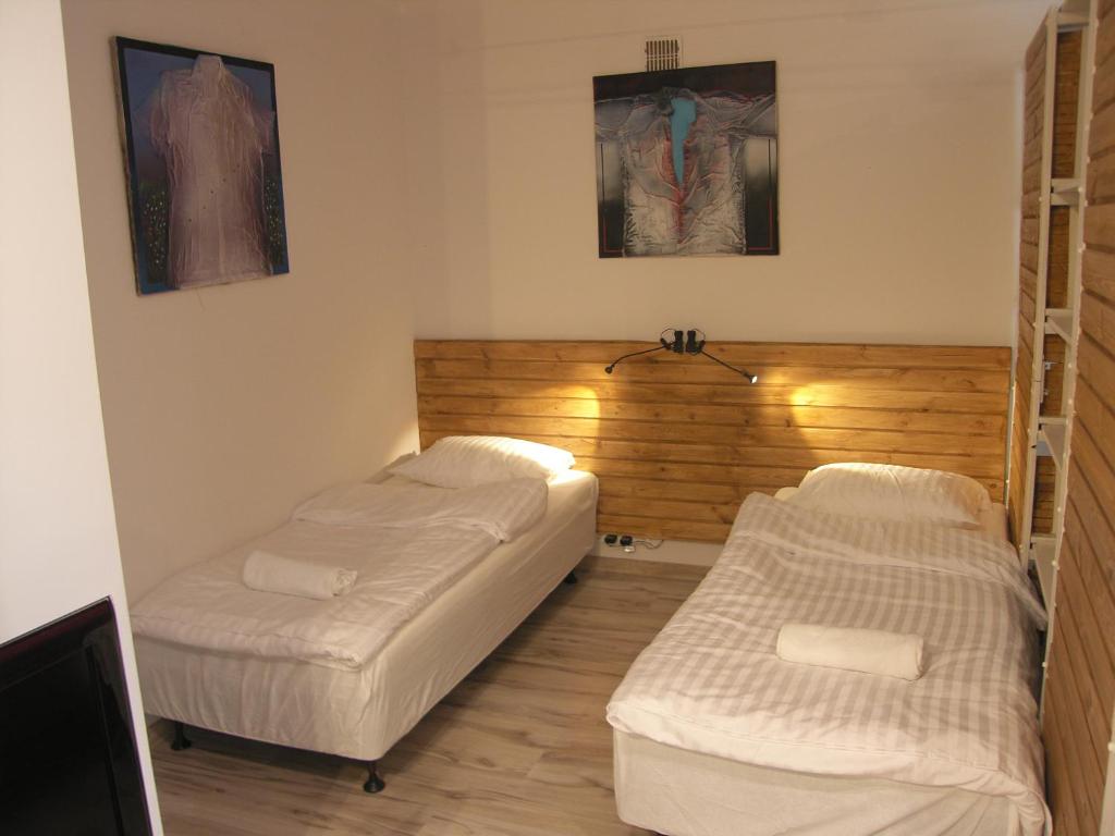 ワルシャワにあるMurano Apartaments City Centerのベッド2台が備わる部屋