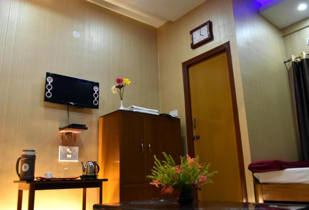 TV a/nebo společenská místnost v ubytování Hotel Gateway Continental