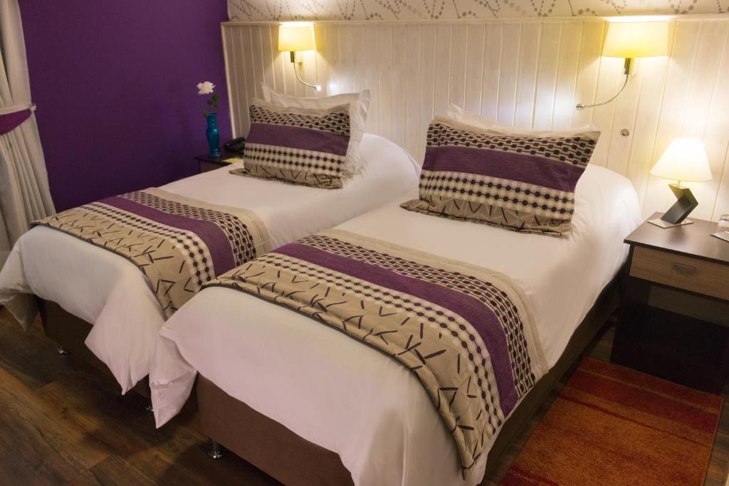 Postel nebo postele na pokoji v ubytování LV Hoteles Boutique