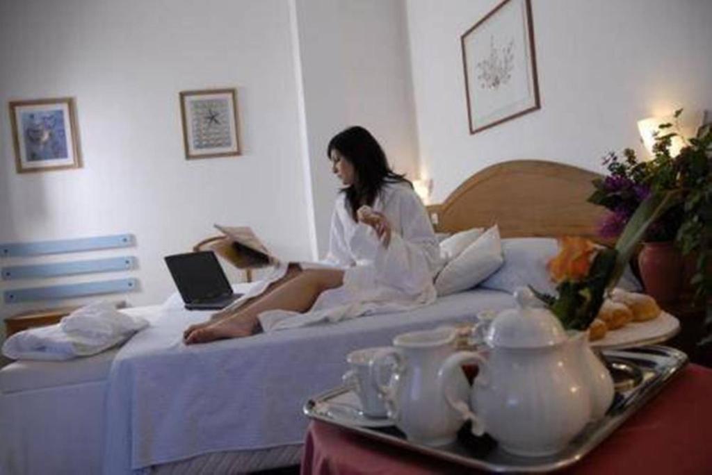 Postel nebo postele na pokoji v ubytování Villa Dei Principi Hotel