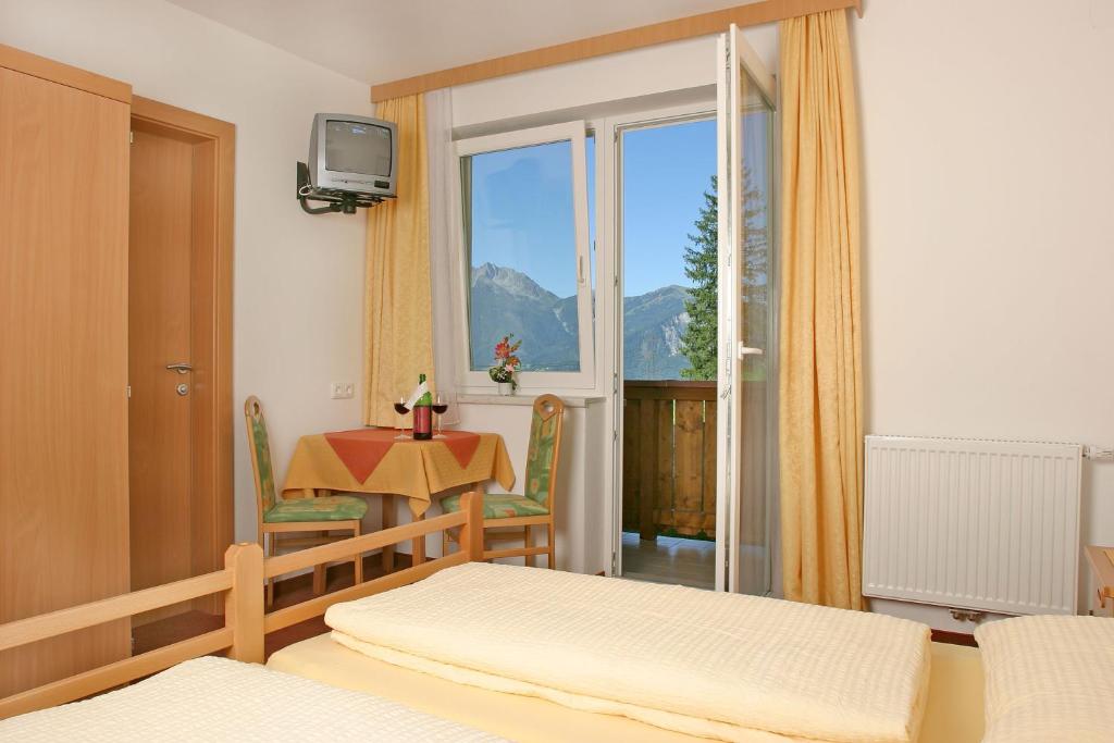 Postel nebo postele na pokoji v ubytování Jugend- und Familienhotel Venedigerhof