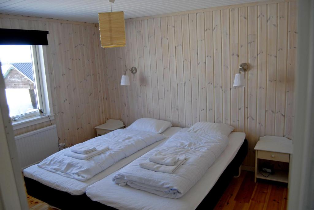 Postel nebo postele na pokoji v ubytování Lakeside House in Lapland