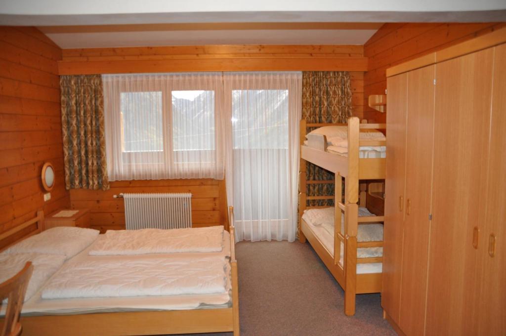 Postel nebo postele na pokoji v ubytování Jugend- und Familienhotel Venedigerhof