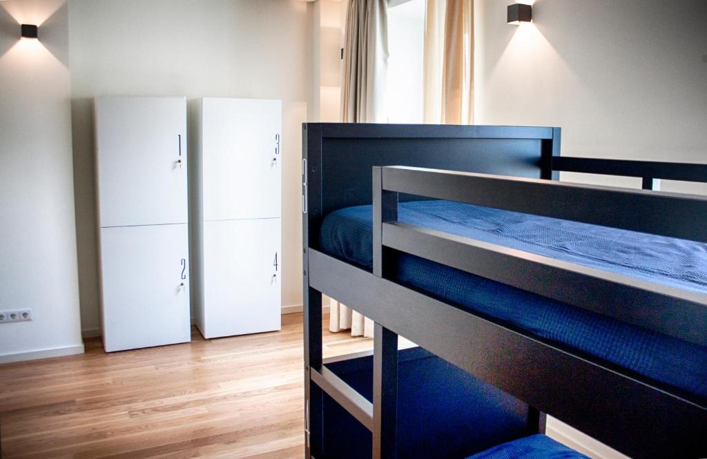 Postel nebo postele na pokoji v ubytování The Nook Hostel