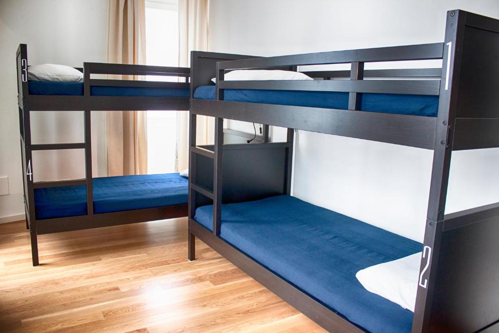 Postel nebo postele na pokoji v ubytování The Nook Hostel