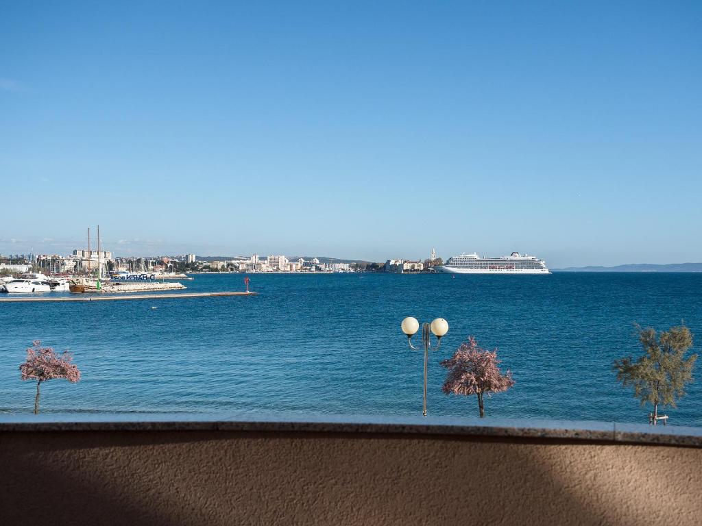 a view of a large body of water with trees at Apartments Nino 1 in Zadar