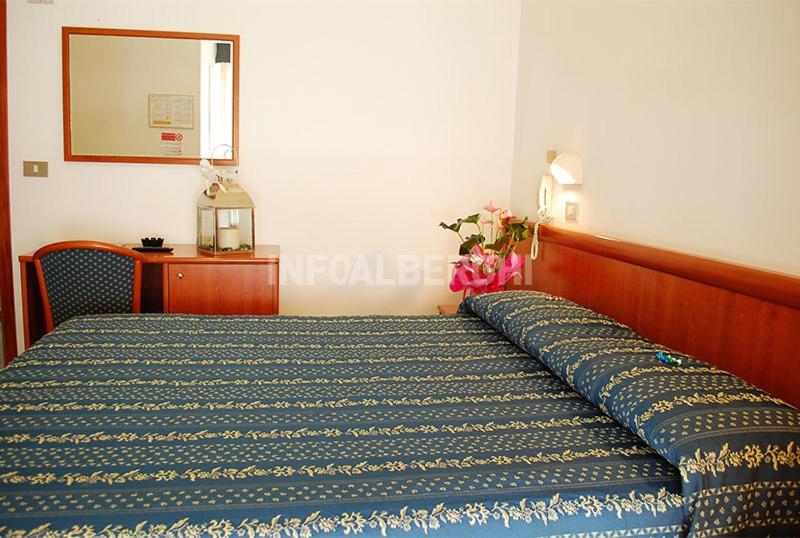 Postel nebo postele na pokoji v ubytování Hotel caesar